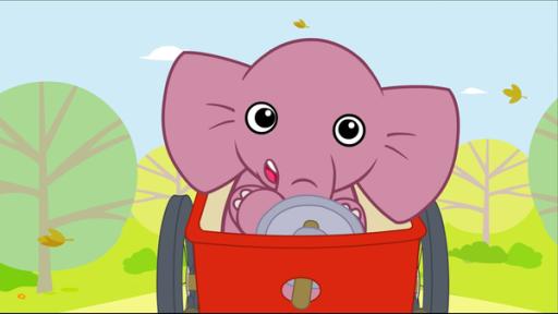 Rechte: KiKA/Studio 88 Der Elefant Tutu fährt in einer roten Kiste mit zwei Rädern auf einem Weg. Mit einem eingebauten Lenkrad steuert er die Kiste.