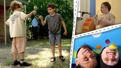 Jungen spielen mit Ballons. Ein Mädchen klopft. Zwei Kinngesichter lachen.