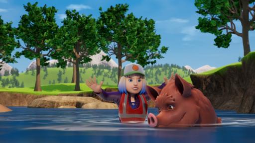 Rechte: 2023 Prism Art & Design Limited Annie steht bis zur Hüfte im Fluss und versucht mit erhobenen Armen ein Wildschwein zu lenken.