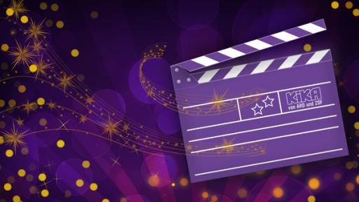 eine Filmklappe vor lila Hintergrund mit goldenen Sternen