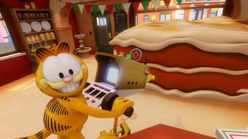 Garfield zielt mit den Strahlenapparat auf eine Lasagne