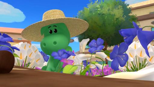 Das Blumentanzfest | Rechte: © 2023 MONDO TV Group, Pagot, Calidra, T2T, ZDFS Der grüne Drache Grisu kniet in einem bunten Blumenbeet und pflanzt eine lilafarbene Blume. Er trägt einen großen Sonnenhut aus Stroh.