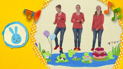 Anni singt den Fröschekanon. Die Frösche feiern ein Fest am See und singen gemeinsam: Quak, Quak! 