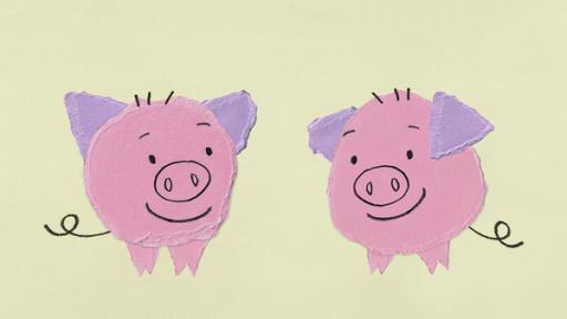 zwei rosa Schweine, die sich anlächeln