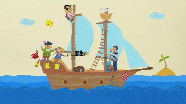 KiKANiNCHEN und seine Freunde sind auf einem Piratenschiff auf dem Meer.