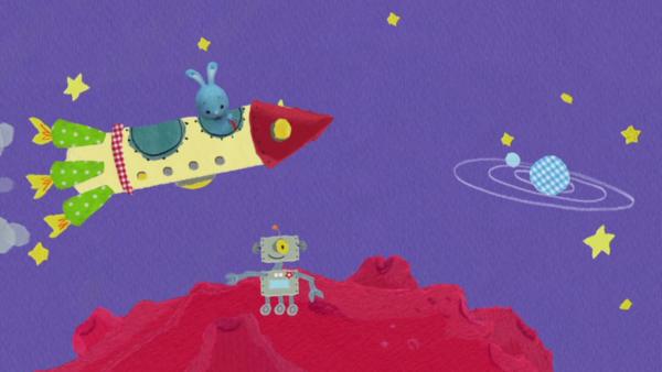 Kikaninchen fliegt in einer Rakete durch das All und beobachtet einen Roboter. 