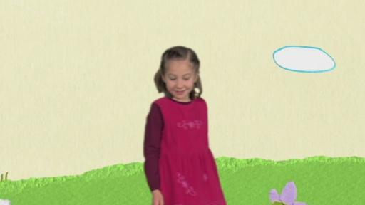Mädchen mit rotem Kleid und KiKANiNCHEN stehen auf großen bunten Blumen
