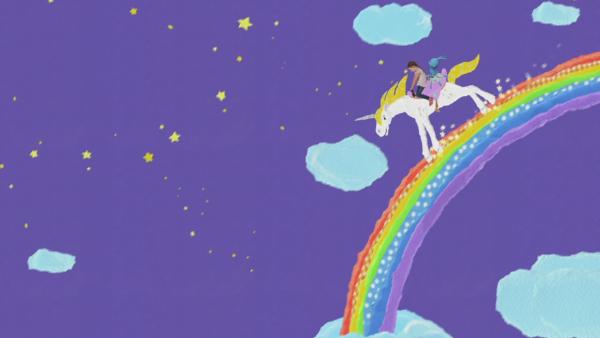 Kikaninchen und ein Mädchen reiten auf einem Einhorn über den Regenbogen.