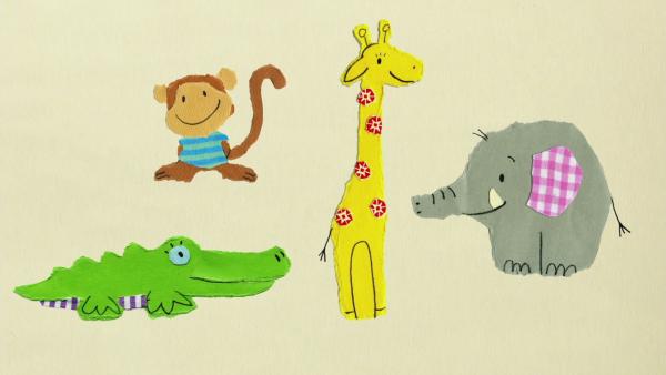Krokodil, Affe, Elefant und Giraffe spielen.