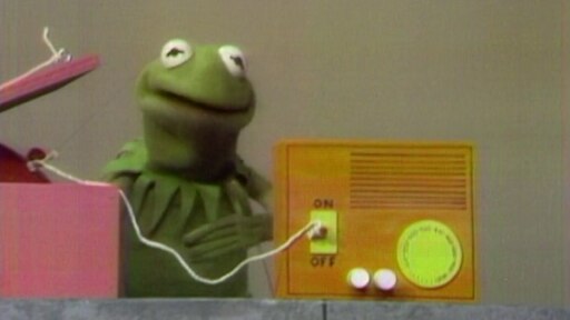 Kermit mit seiner Maschine