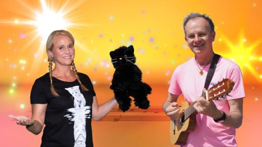 Katerstrophenlieder | Rechte: MES SingAlarm: Moderatorin Singa mit Willy Astor im SingAlarm Studio. Singa hat den Katerstrophen-Kater in der Hand und Willy Astor seine Gitarre.
