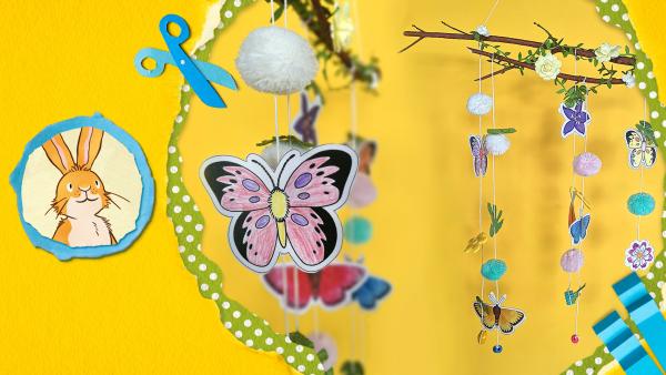 Frühlingszweig mit bunten Blumen, Blüten und Schmetterlingen 