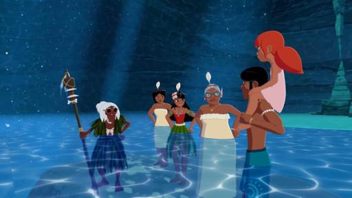 Ramana, Maeva, Timeti und Faratina stehen im halbhohen Wasser einer Unterwasserhöhle und schauen empört zu Auru und Marina. Auru trägt Marina auf seinen Schultern.